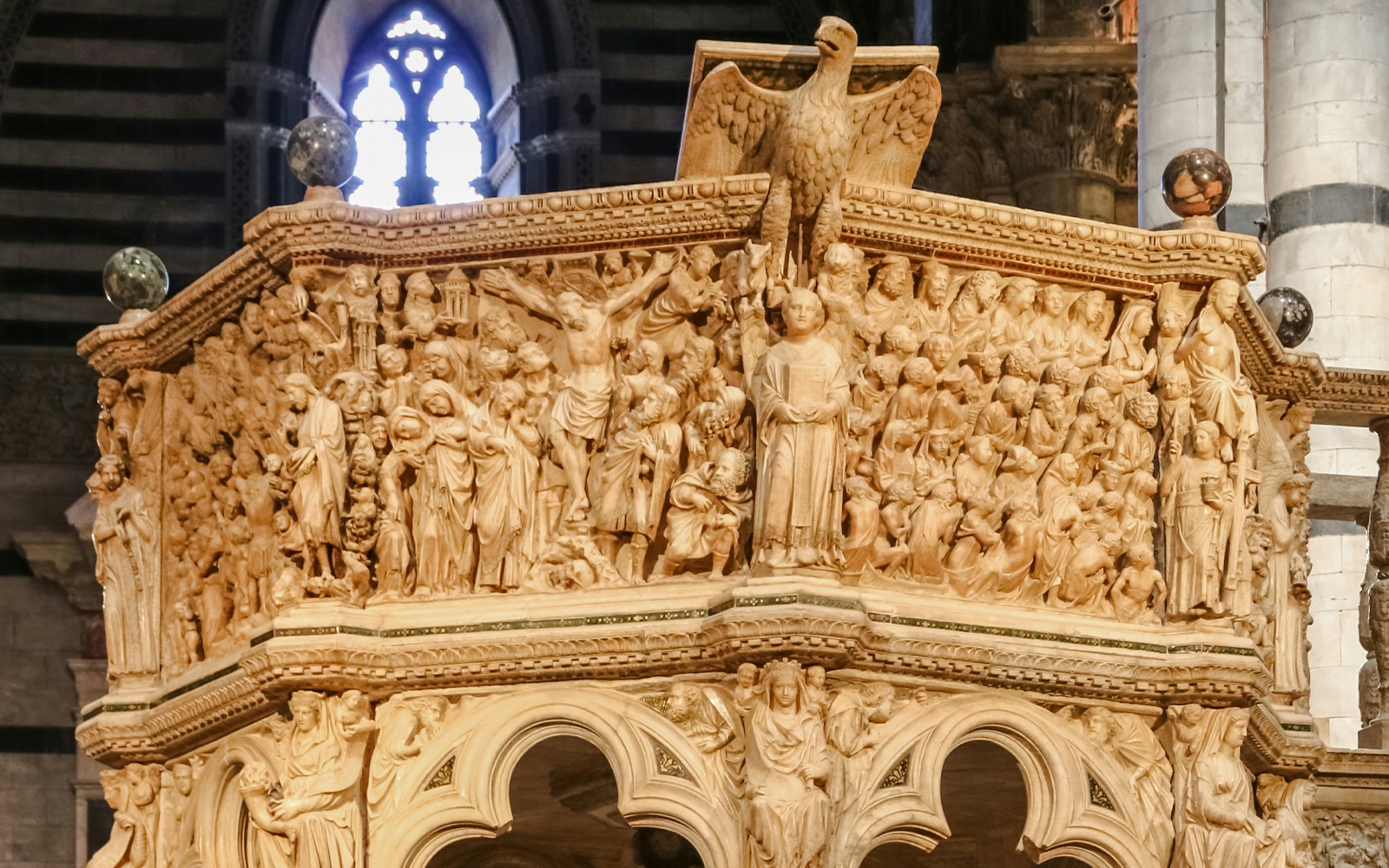 Relief panels on Nicola Pisano’s Pulpit depicting biblical scenes, Pisa Cathedral.