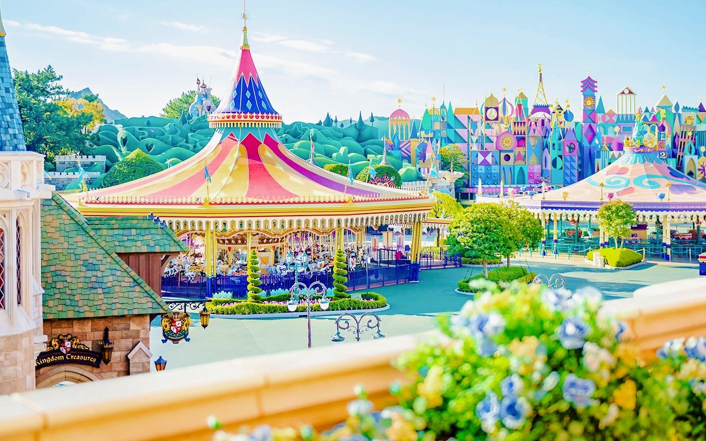 Colourful carousel and attractions at Tokyo Disneyland.
