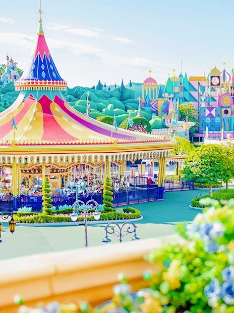 Colourful carousel and attractions at Tokyo Disneyland.
