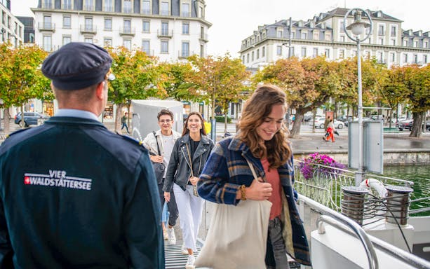 Passengers boarding the panorama-yacht Saphir for a 1-hour scenic cruise.