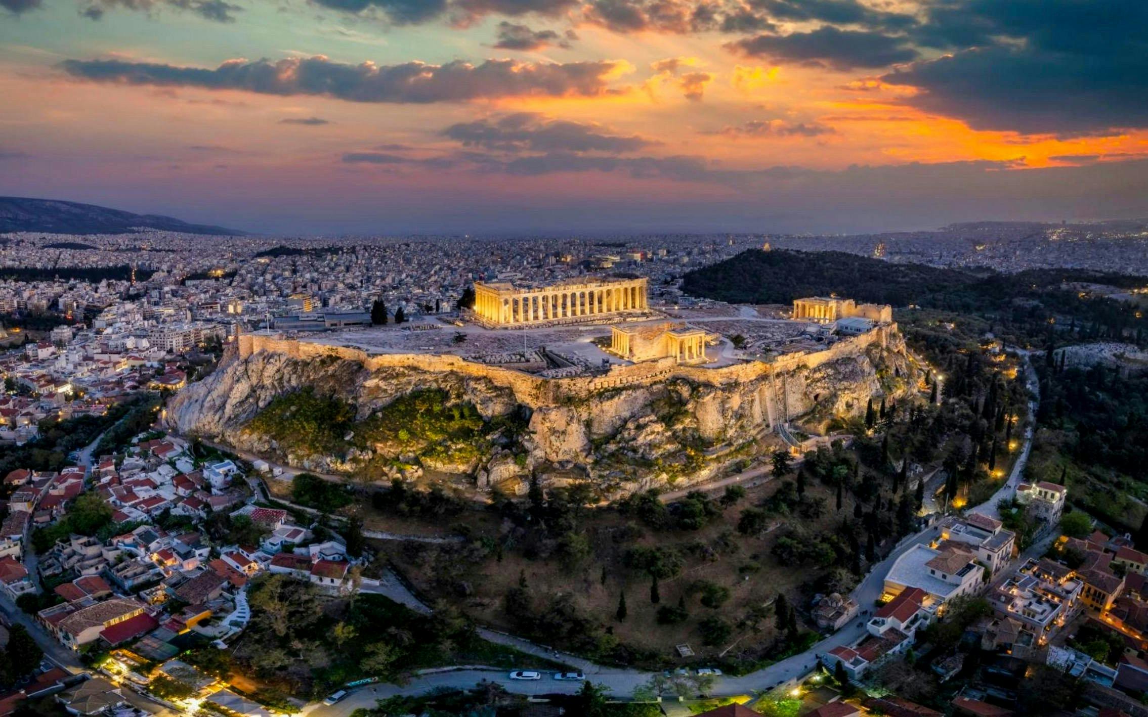 Acropolis and Parthenon at sunset, Athens skyline view.