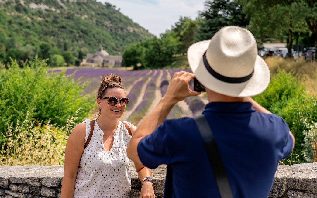 Person posing for a photo in front of lavender fields in Luberon during a morning tour.