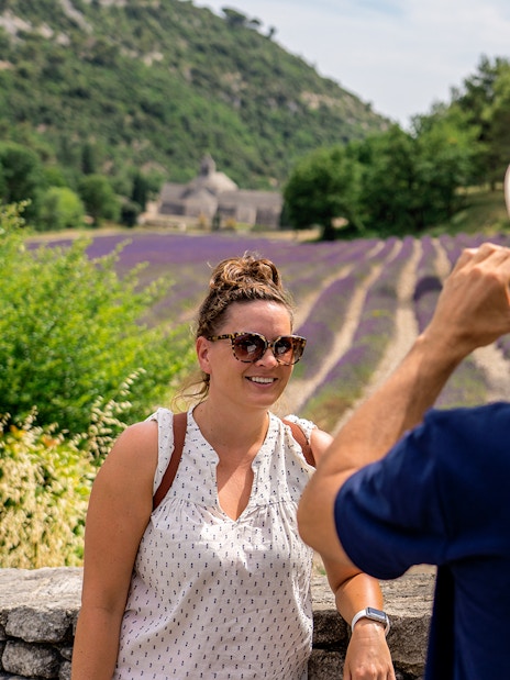 Person posing for a photo in front of lavender fields in Luberon during a morning tour.