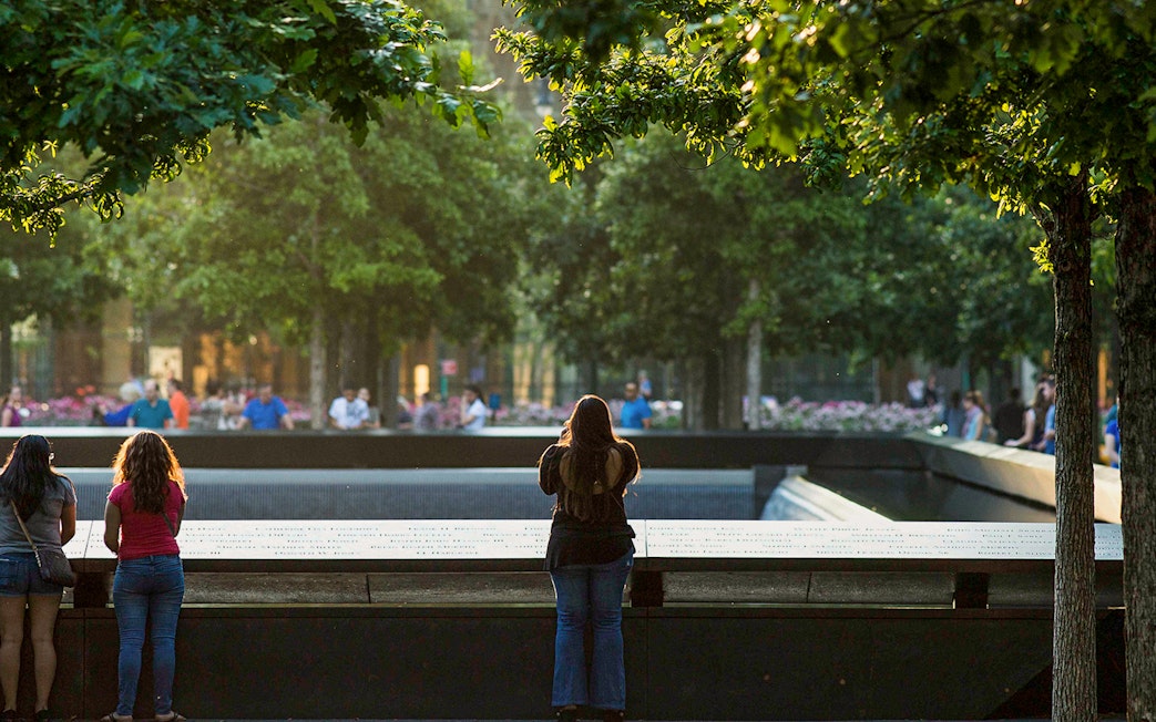 Women observing the 9/11 Memorial in New York City.