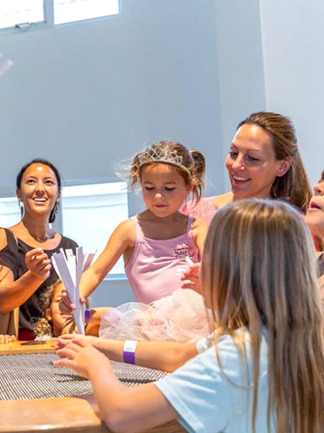 Kids and mother interacting with air exhibit at Olioli Children's Play Museum Dubai.