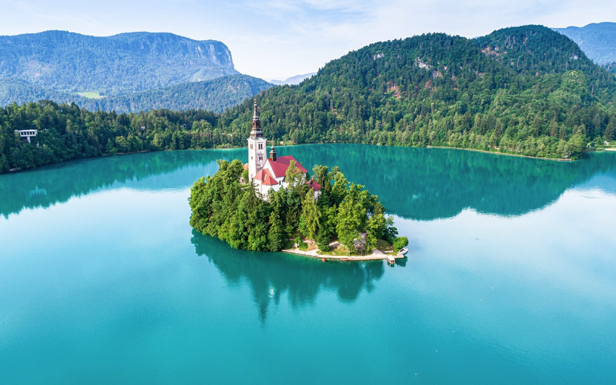Bled Castle overlooking Lake Bled with island church, Slovenia.