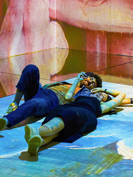 Couple enjoying immersive art experience at Frameless.