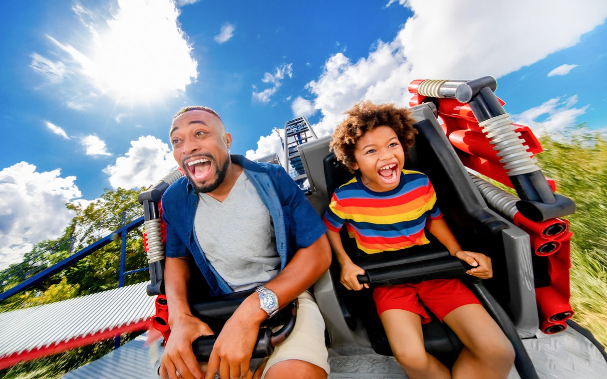 Visitors enjoying The Great Legorac ride at LEGOLAND Theme Park, Florida.
