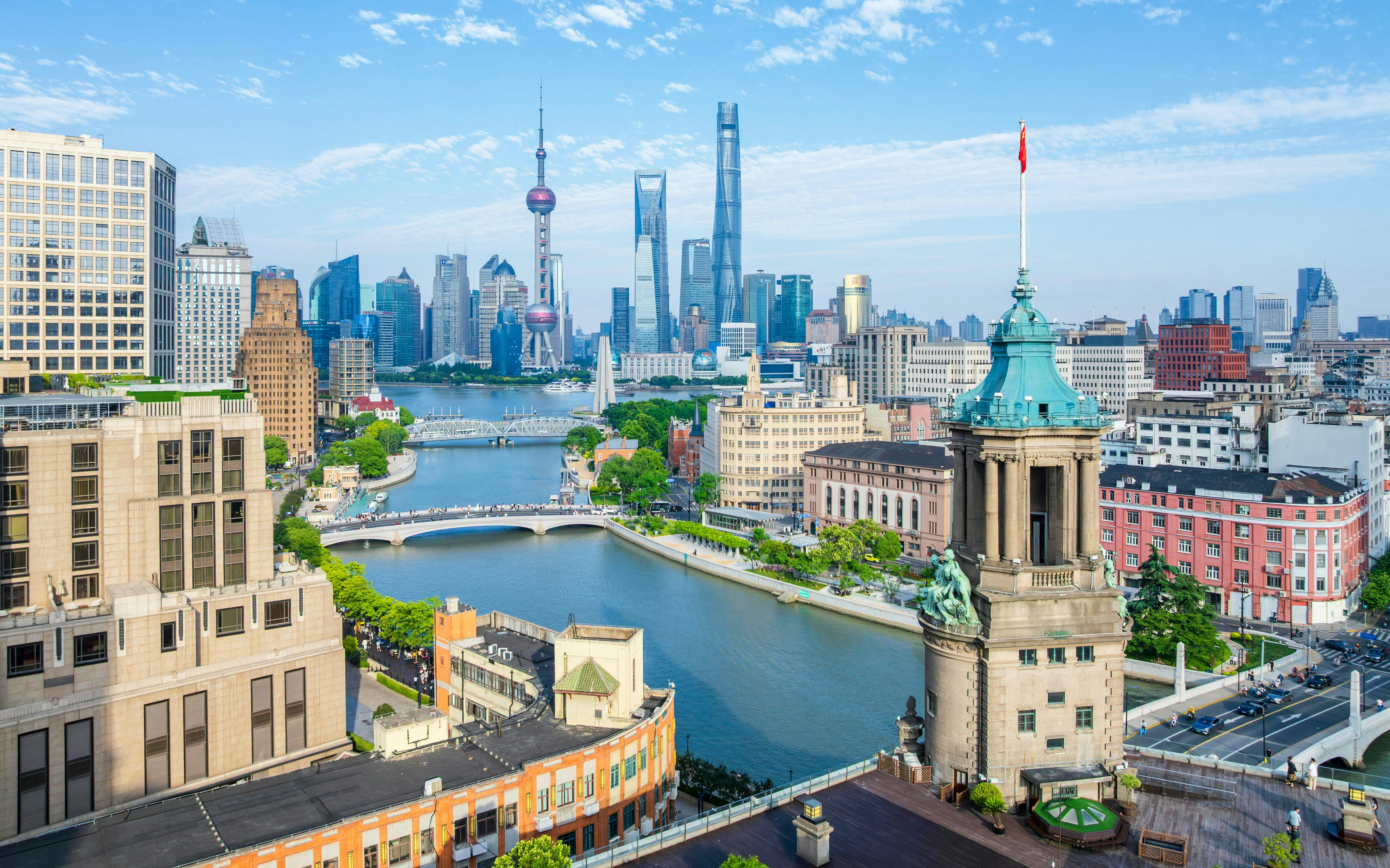 Shanghai skyline with the Postal Museum in the foreground and Lujiazui skyscrapers in the distance.