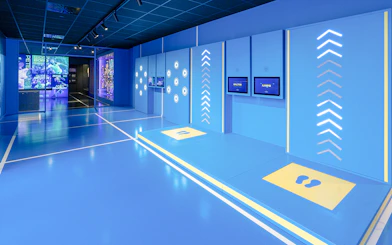 Interactive exhibits inside the Rafa Nadal Museum showcasing sports technology.