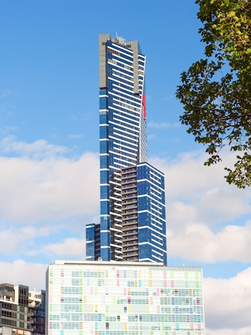 Eureka Skydeck in Melbourne, Australia, towering against a blue sky.
