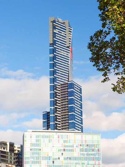 Eureka Skydeck in Melbourne, Australia, towering against a blue sky.