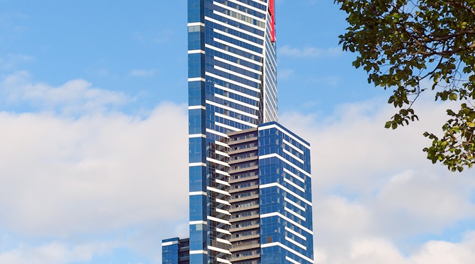 Eureka Skydeck in Melbourne, Australia, towering against a blue sky.