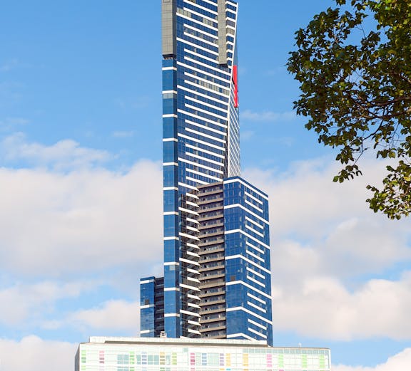Eureka Skydeck in Melbourne, Australia, towering against a blue sky.