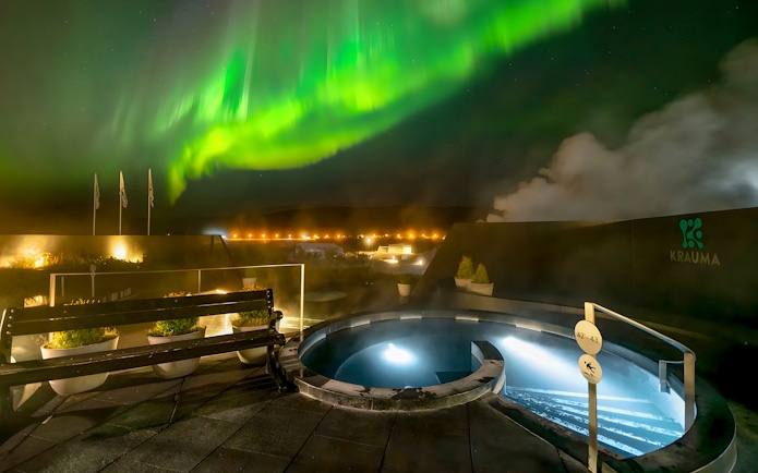 Krauma Geothermal Baths with Northern Lights in Iceland.