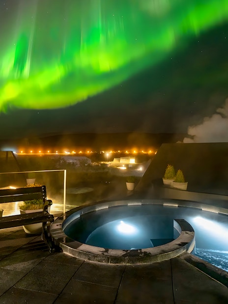 Krauma Geothermal Baths with Northern Lights in Iceland.