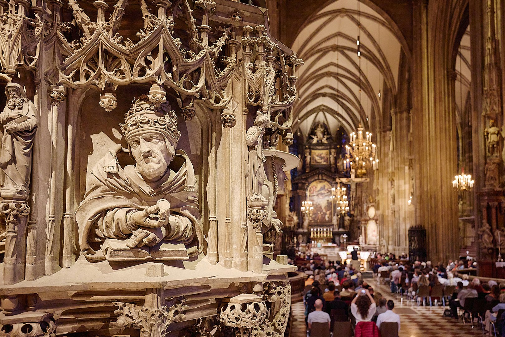 St. Stephen's Cathedral interior with ornate pulpit and audience at Giant Organ Concert.