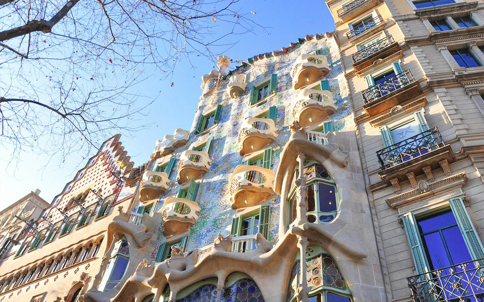 Casa Batlló's unique facade with organic shapes and colorful mosaics in Barcelona.