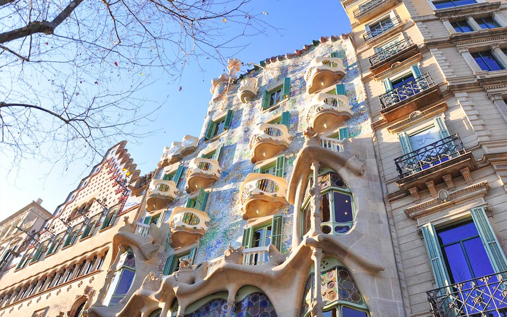 Casa Batlló's unique facade with organic shapes and colorful mosaics in Barcelona.