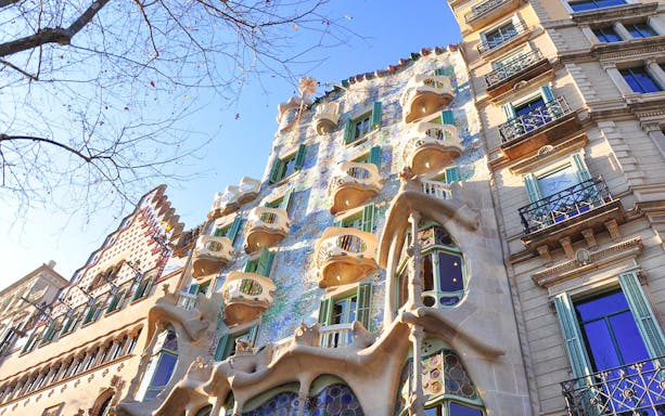 Casa Batlló's unique facade with organic shapes and colorful mosaics in Barcelona.