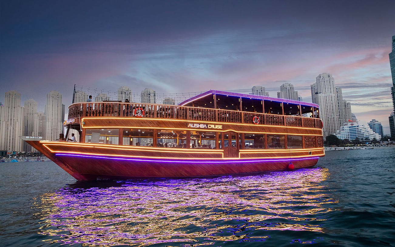 Dhow cruise with lights at Marina, skyscrapers in background, Alishba Cruise.