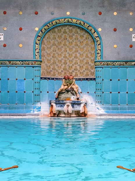Indoor pool with ornate fountain at Gellert Spa, Budapest.