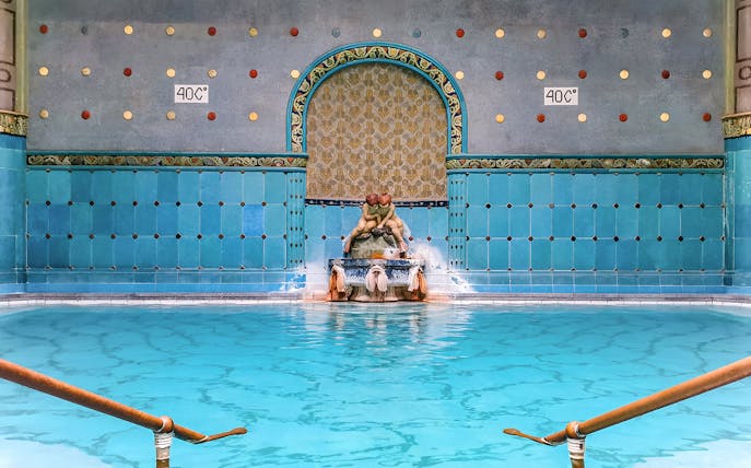 Indoor pool with ornate fountain at Gellert Spa, Budapest.