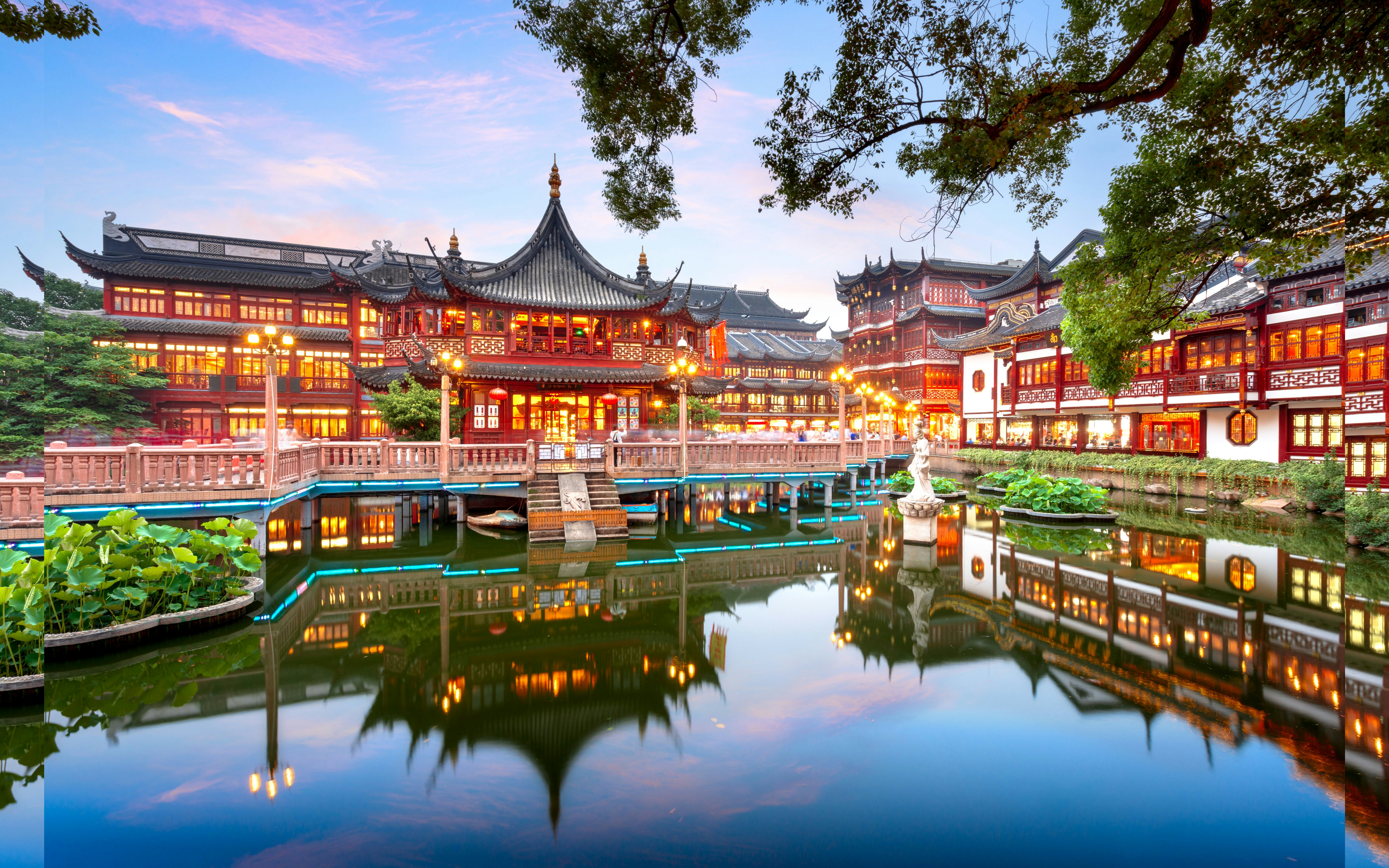 Yuyuan Garden traditional architecture reflected in pond, Shanghai, China.