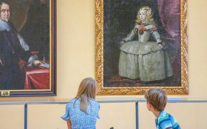Children viewing portraits at Lobkowicz Palace Museum, Prague.