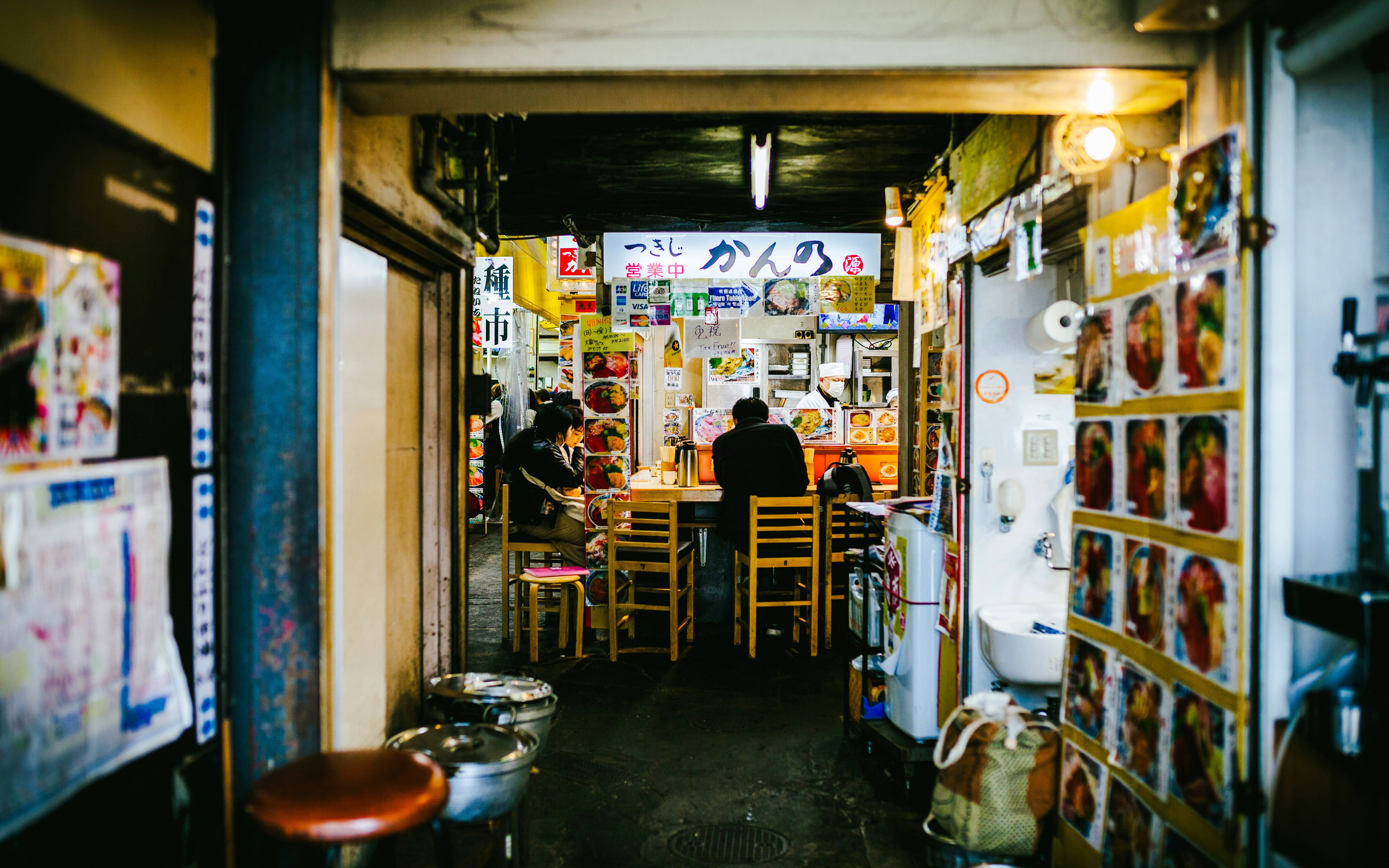 Tokyo street food stall with people dining inside.