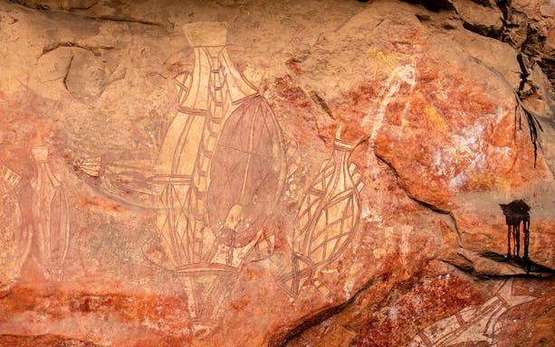 Ancient rock art depicting figures at Kakadu National Park, Darwin.