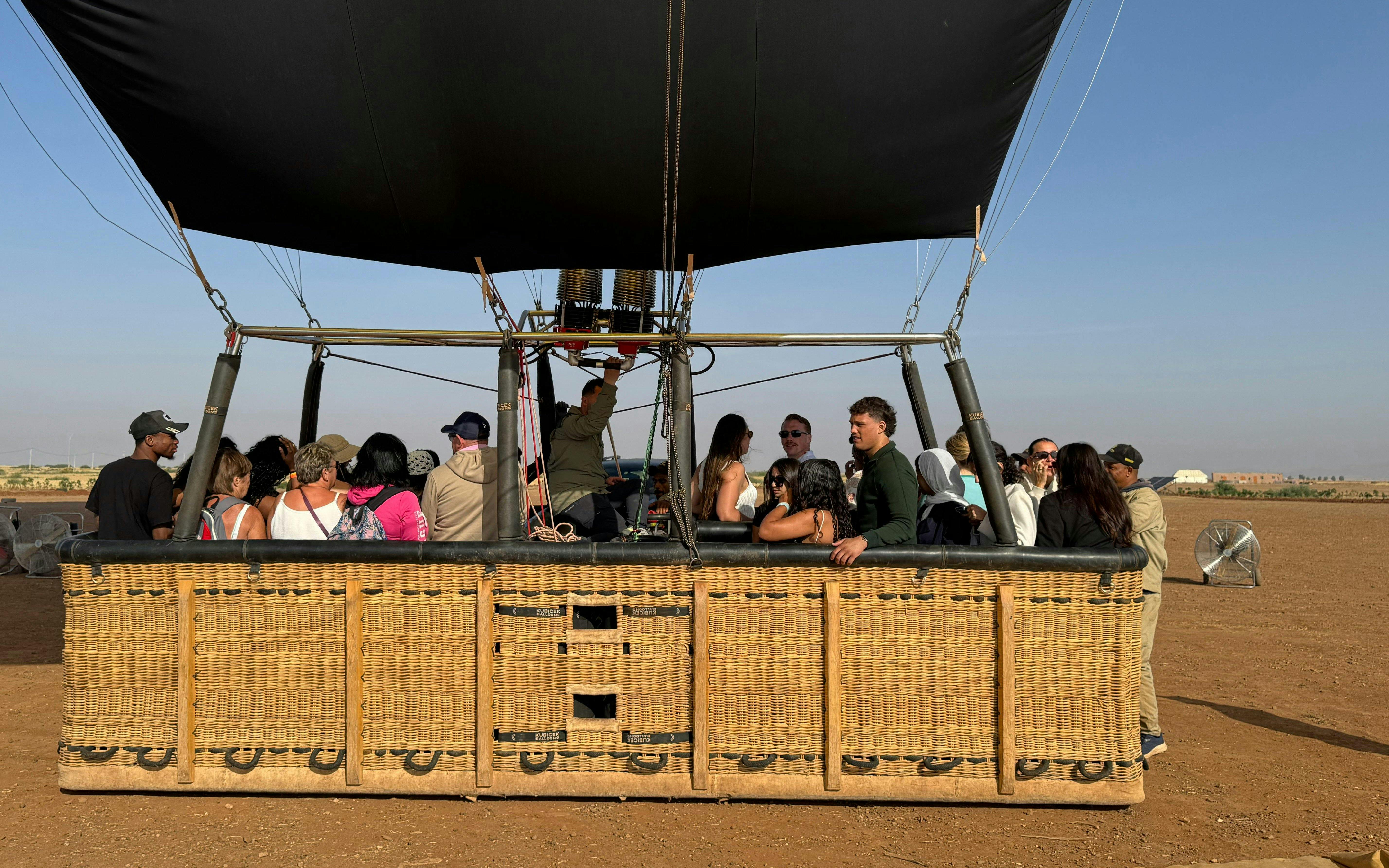 Tourists preparing for a hot air balloon flight over Marrakech.