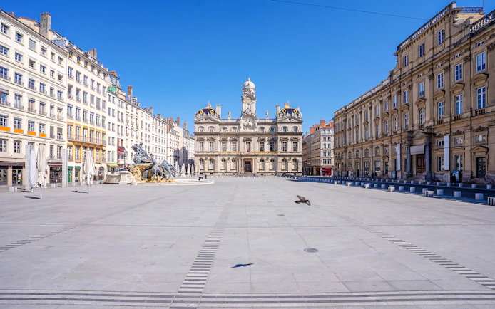 Place des Terreaux in Lyon with Bartholdi Fountain and city hall in the background.