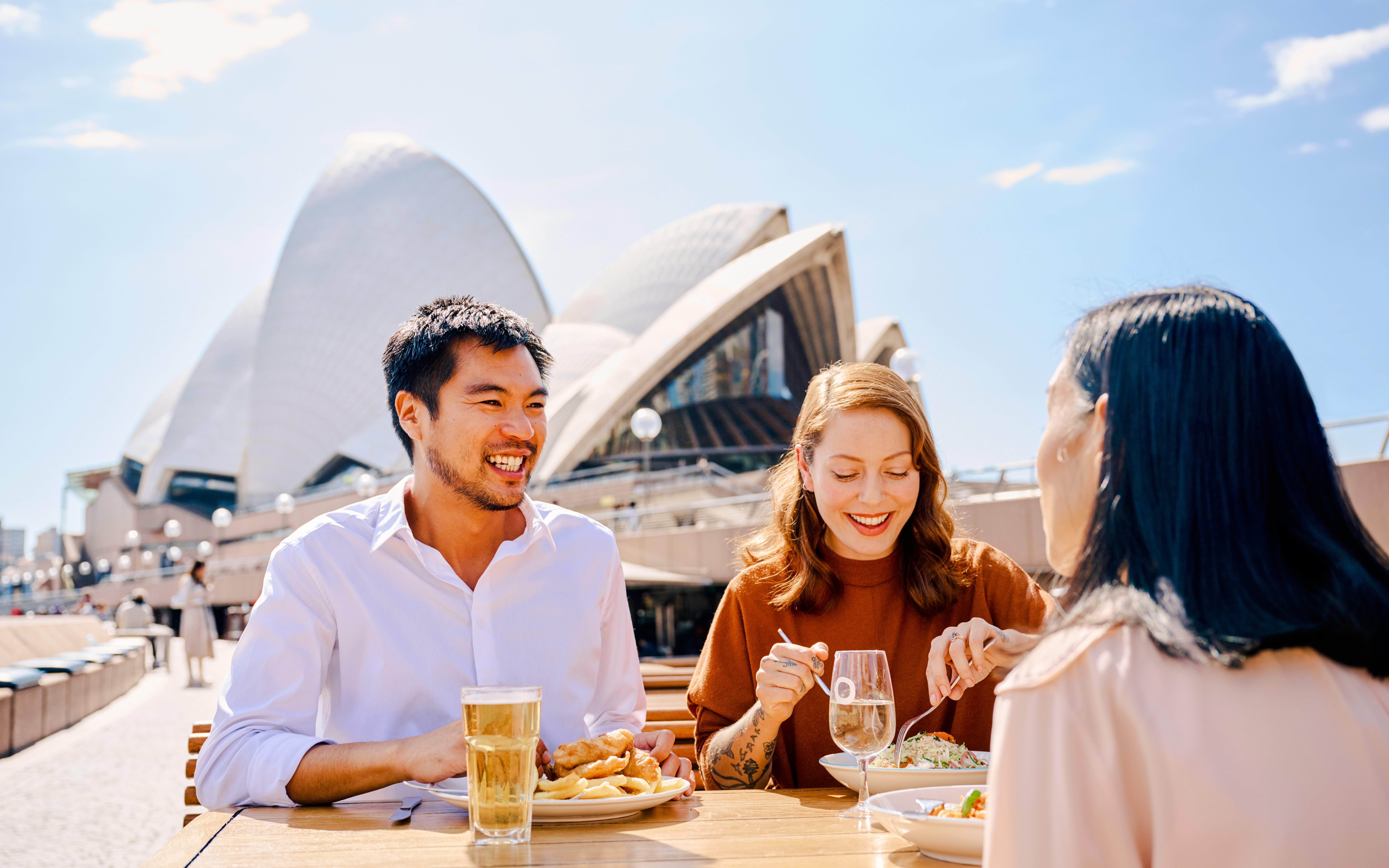 Dining at Sydney Opera House with meals and drinks during guided tour.