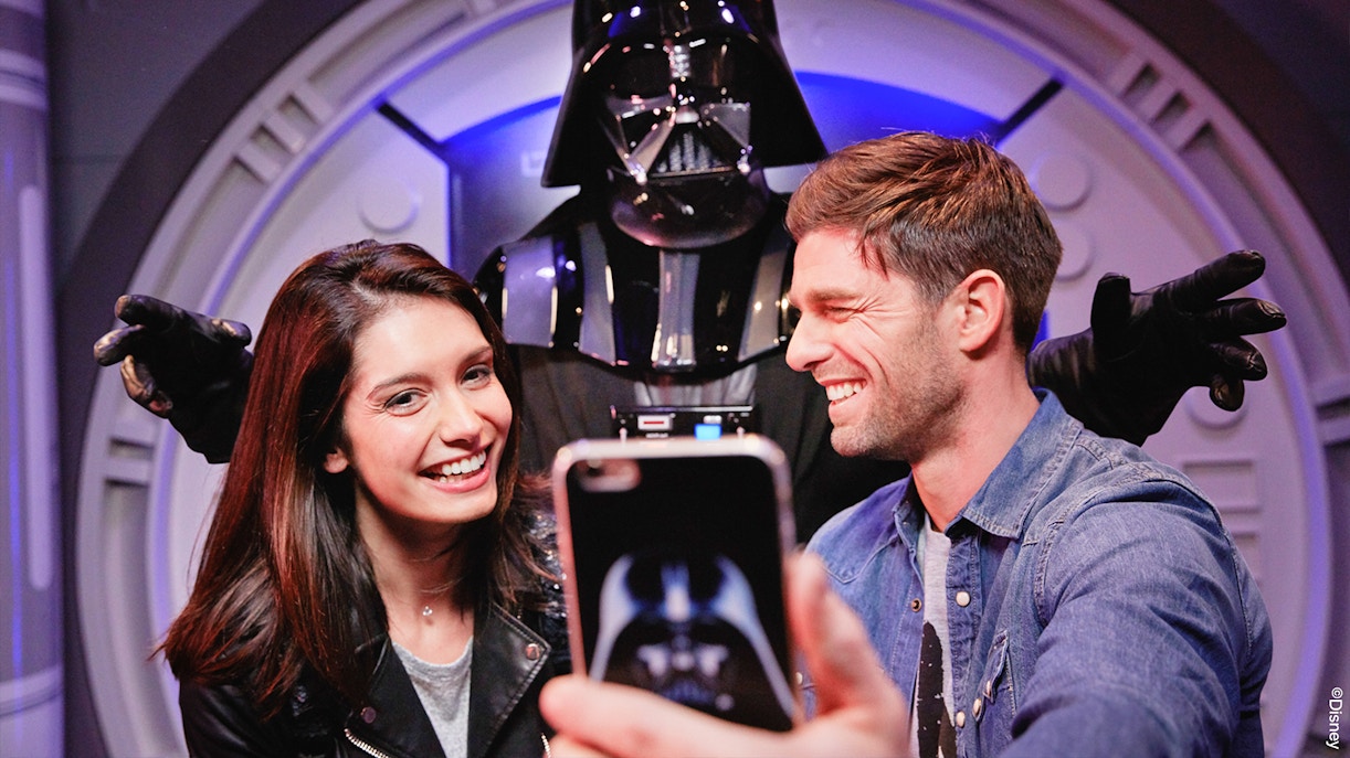 Visitors posing with Darth Vader at Disneyland Paris.