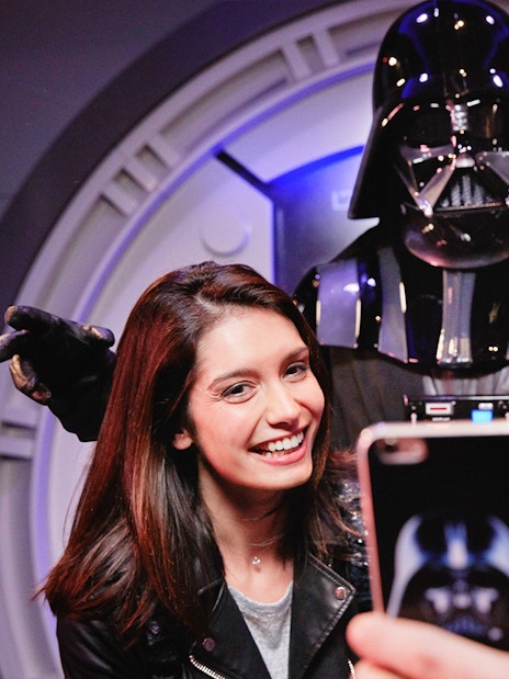 Visitors posing with Darth Vader at Disneyland Paris.