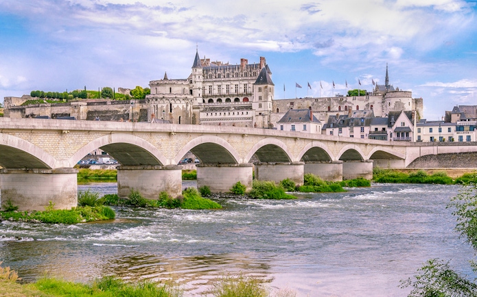Royal Amboise Castle with bridge over Loire River, France.