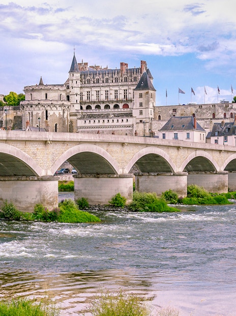 Royal Amboise Castle with bridge over Loire River, France.