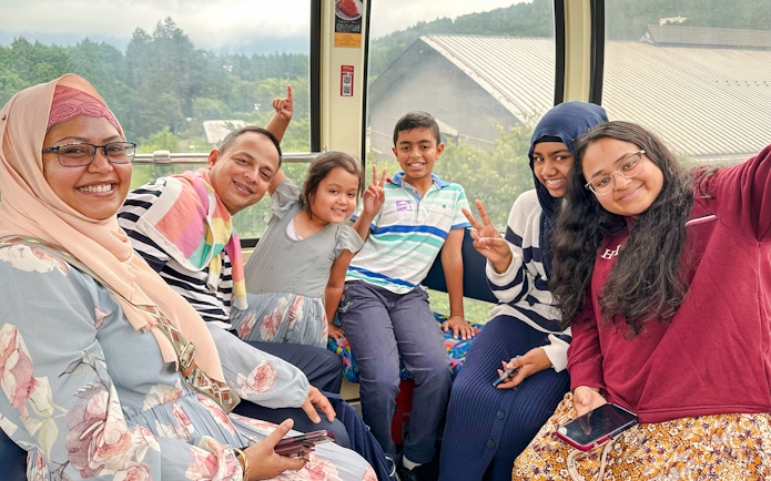 Family enjoying a cable car ride on Mount Fuji and Hakone Premium Tour.