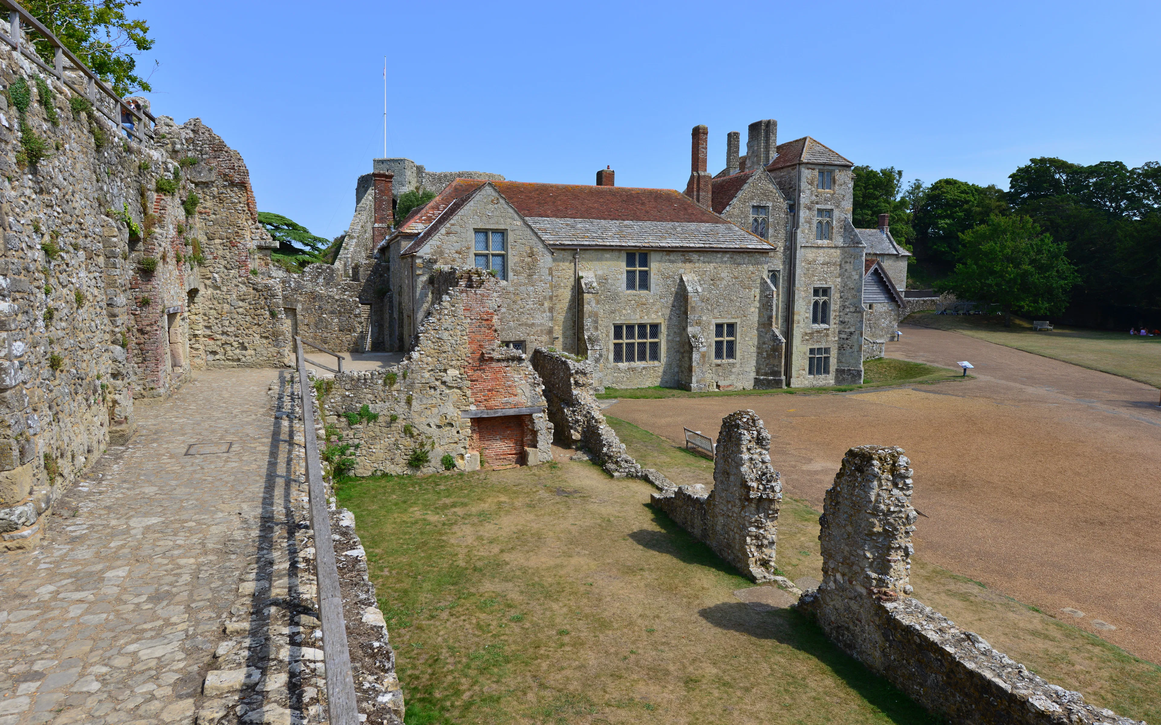 Inner courtyard of a historic castle on the Isle of Wight with stone walls and pathways.