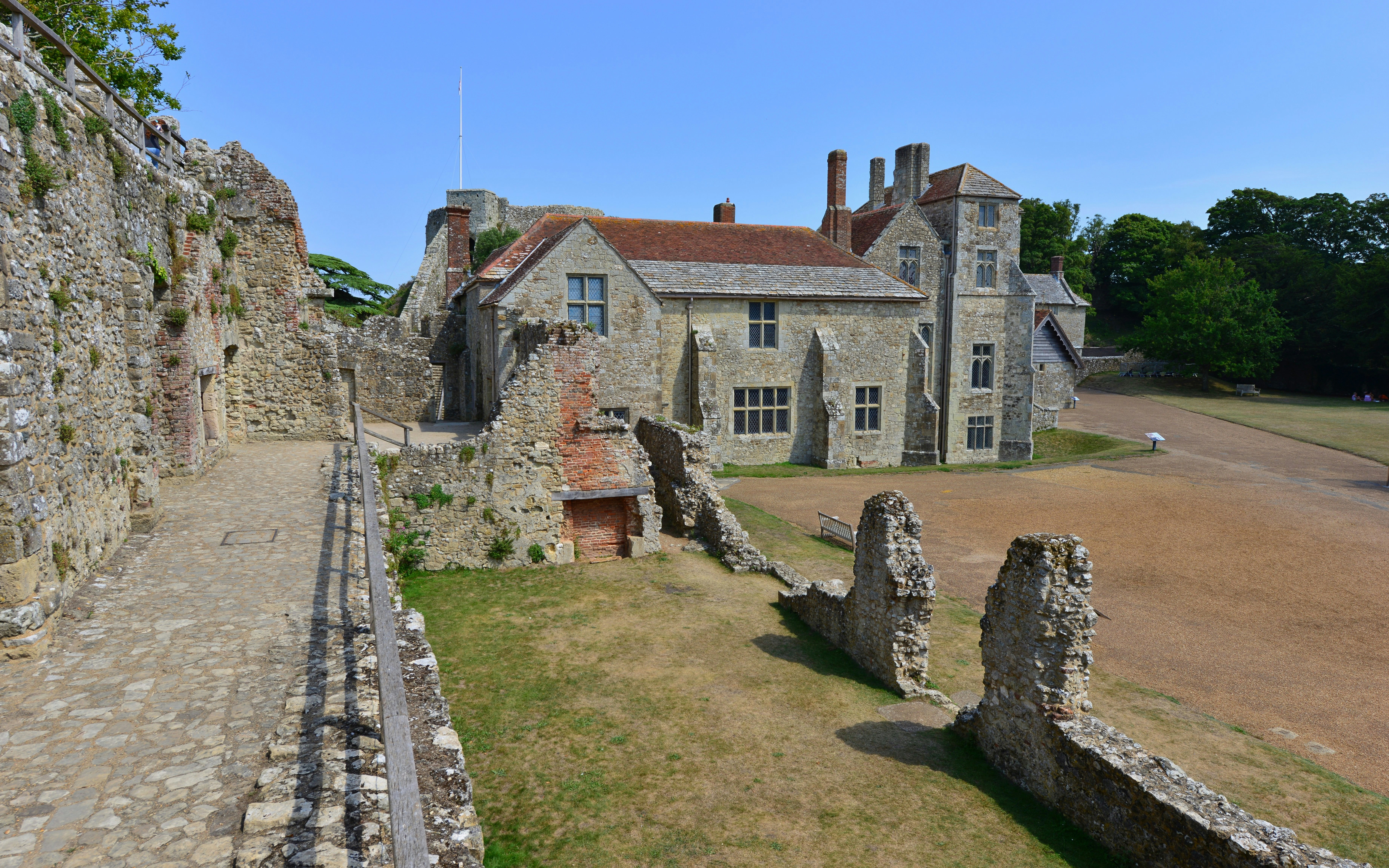 Inner courtyard of a historic castle on the Isle of Wight with stone walls and pathways.