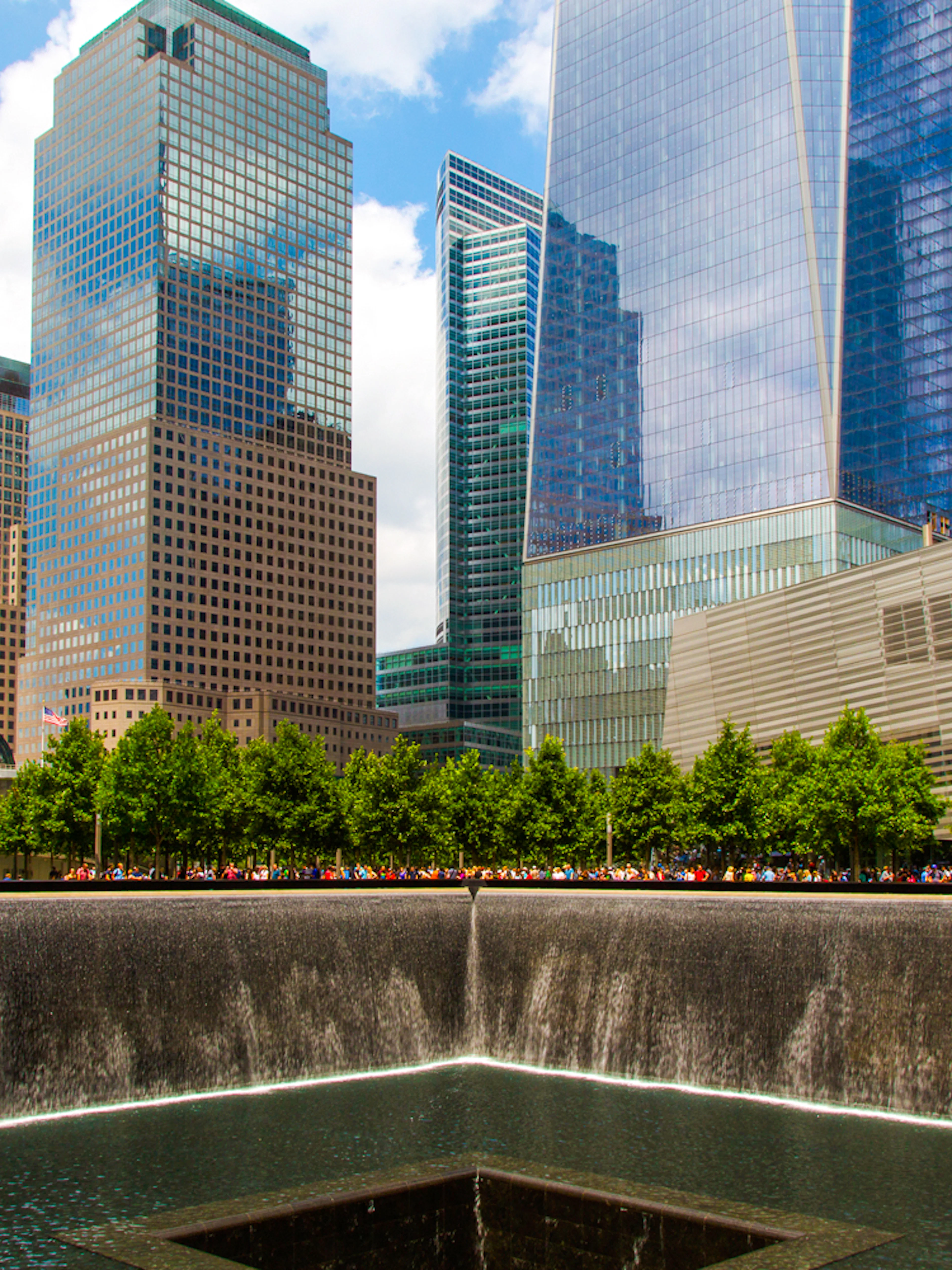 North Pool at National September 11 Memorial Museum, New York City, with surrounding skyscrapers.