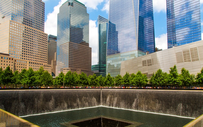 North Pool at National September 11 Memorial Museum, New York City, with surrounding skyscrapers.