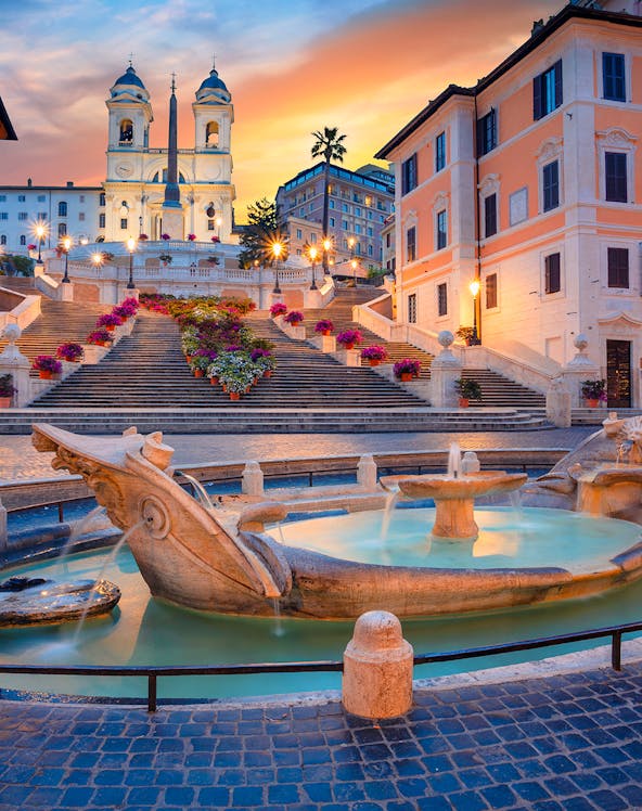Spanish Steps and Barcaccia Fountain at sunset in Rome, Italy.