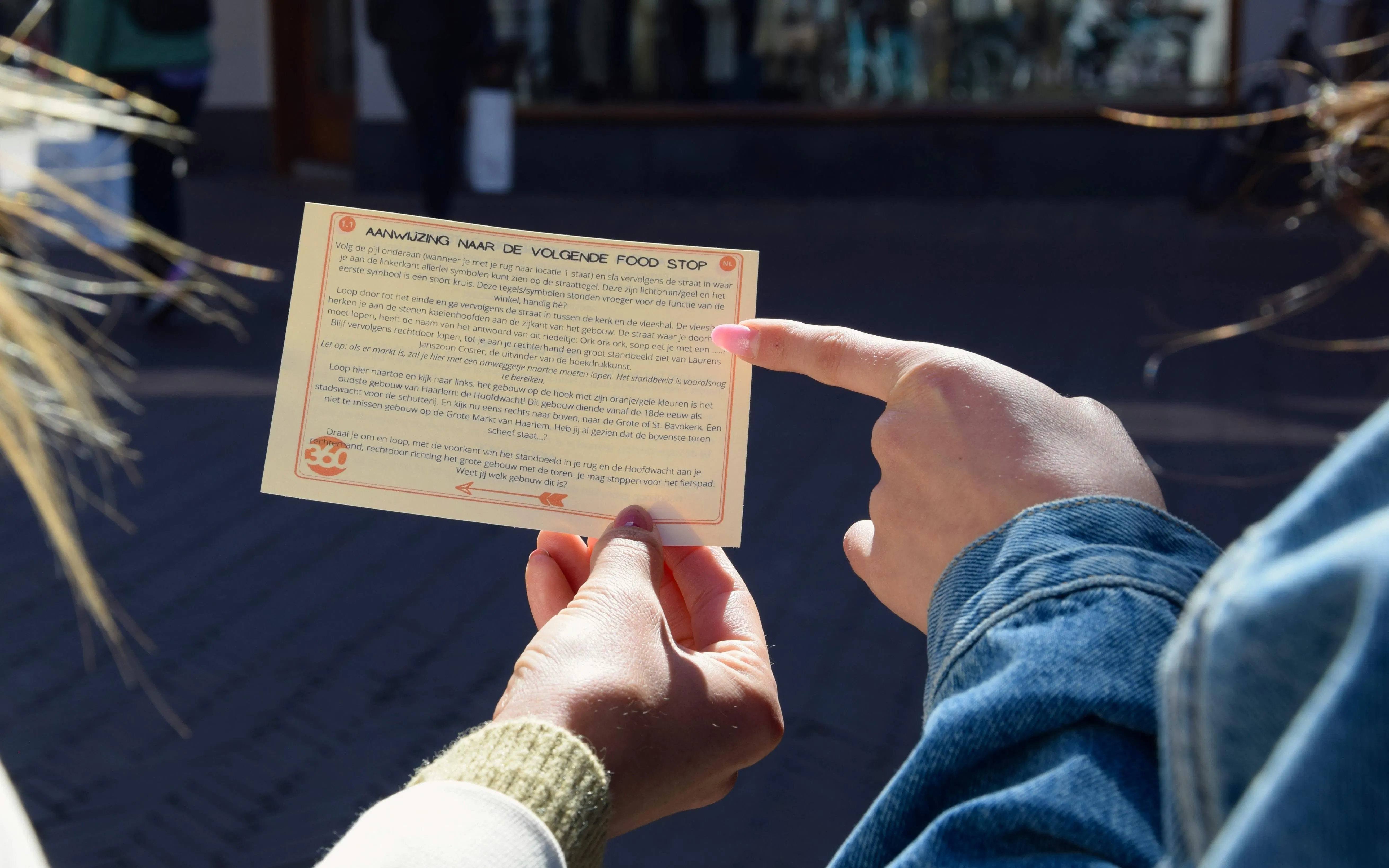 Tour participants reading a food tour guide in Haarlem.