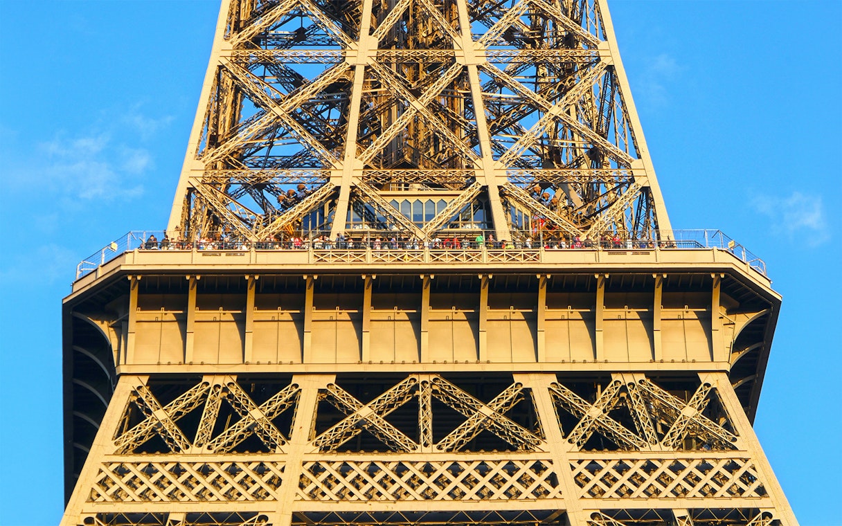 Eiffel Tower viewing platform with visitors, Paris Essentials City Pass.