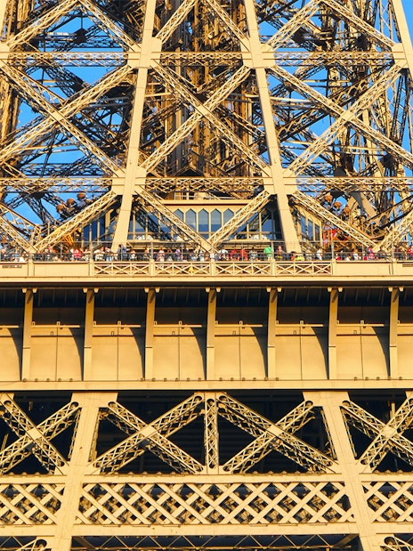 Eiffel Tower viewing platform with visitors, Paris Essentials City Pass.