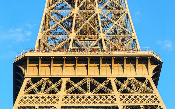 Eiffel Tower viewing platform with visitors, Paris Essentials City Pass.