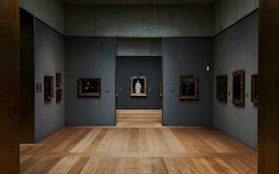 Kunsthaus Zürich museum gallery with framed paintings on dark walls and wooden floors.