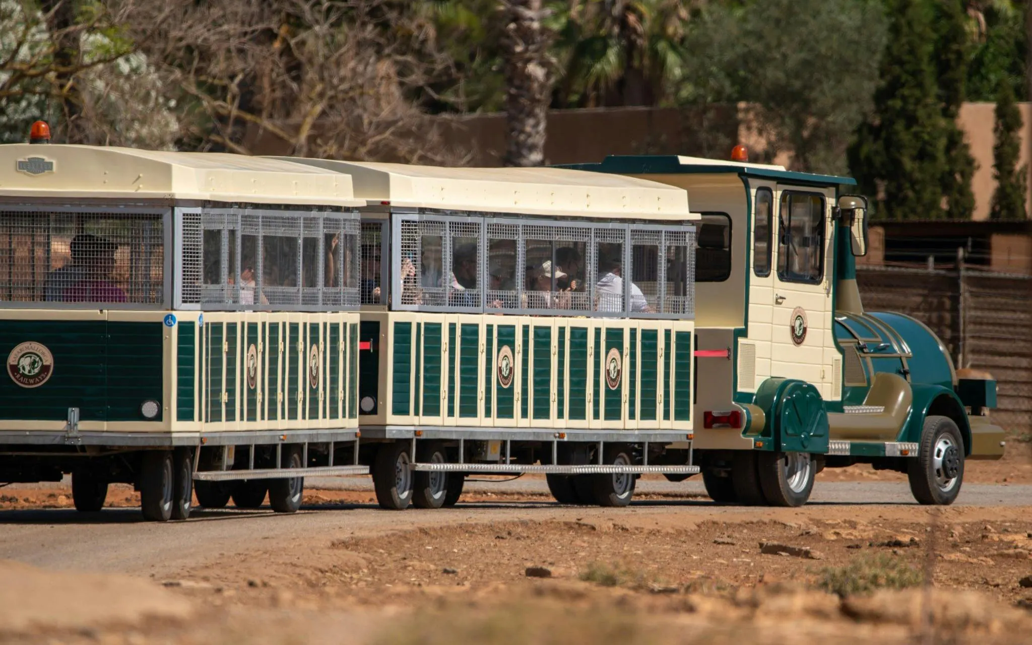 Safari tour train in Mallorca transporting visitors through a scenic route.